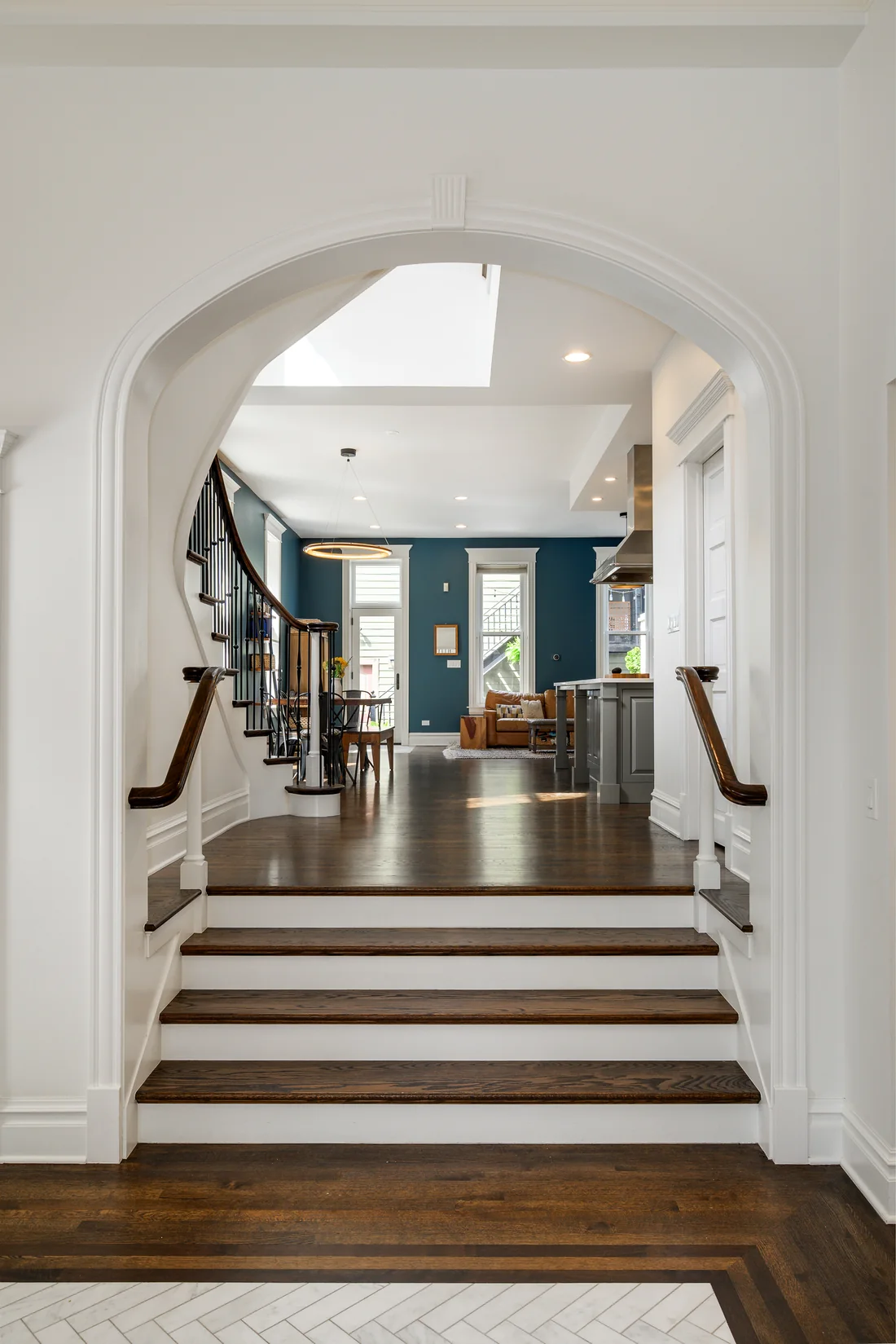 Arched doorway framing a stepped approach into a home